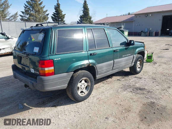 1997 Jeep Grand Cherokee Laredo with VIN 1J4GZ58S2VC595442, listed as a IAAI auction lot 41772133 with 229,764 mi miles. Bid and sale history available at carsss.com. Image 4.