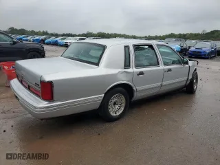 1997 Lincoln Town Car Executive with VIN 1LNLM81W1VY719314, listed as a Copart auction lot 73950324 with 0 mi miles and Salvage Title. Bid and sale history available at carsss.com. Image 3.