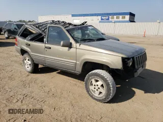 1998 Jeep Grand Cherokee Limited with VIN 1J4GZ78Y2WC146974, listed as a Copart auction lot 71435484 with 192,996 mi miles and Salvage Title. Bid and sale history available at carsss.com. Image 4.