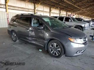 2014 Honda Odyssey Touring with VIN 5FNRL5H99EB111525, listed as a Copart auction lot 61986005 with 137,905 mi miles and Salvage title. Bid and sale history available at DreamBid. Image 4.