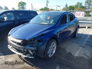 2023 Tesla Model Y Long Range with VIN 7SAYGDEE0PF762592, listed as a IAAI auction lot 41983933 with 28,510 mi miles and . Bid and sale history available at carsss.com. Image 2.