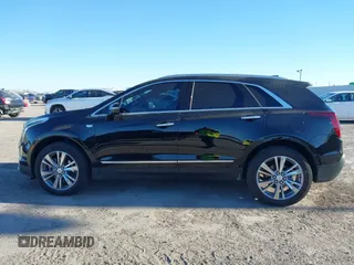 2024 Cadillac XT5 FWD Premium Luxury with VIN 1GYKNCRS4RZ729461, listed as a IAAI auction lot 41411300 with 5,760 mi miles. Bid and sale history available at carsss.com. Image 14.