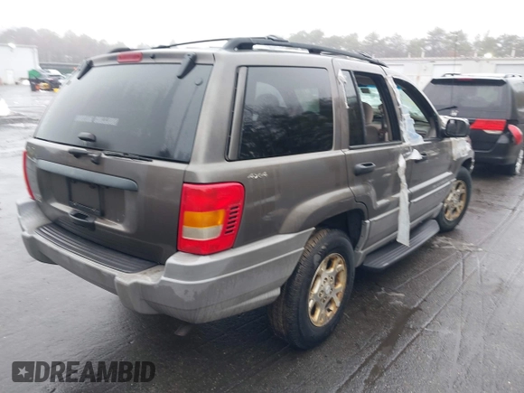 2000 Jeep Grand Cherokee Laredo with VIN 1J4GW48S1YC170303, listed as a IAAI auction lot 41582257 with 191,062 mi miles and . Bid and sale history available at DreamBid. Image 4.