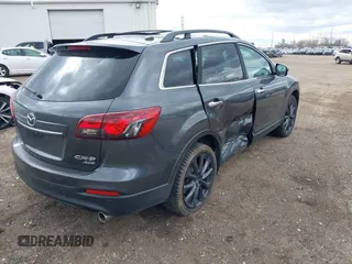2015 Mazda CX-9 Grand Touring with VIN JM3TB3DV1F0465966, listed as a IAAI auction lot 42049749 with 74,470 mi miles and . Bid and sale history available at DreamBid. Image 4.
