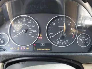 2014 BMW 3 Series 320i with VIN WBA3B1C56EK131849, listed as a IAAI auction lot 42018005 with 215,765 mi miles. Bid and sale history available at carsss.com. Image 7.