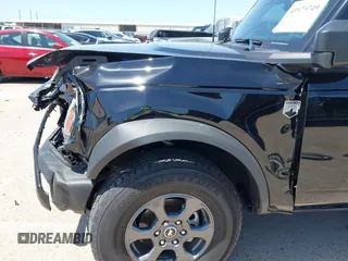 2024 Ford Bronco Big Bend z VIN 1FMDE7BH5RLA53797, wystawiony jako IAAI lot #41920749 z przebiegiem 13 399 mil mil oraz . Historia ofert i sprzedaży dostępna na DreamBid. Obrazek 6.