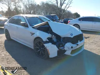 2019 BMW M5 Competition with VIN WBSJF0C57KB285614, listed as a IAAI auction lot 39011419 with 1 mi miles. Bid and sale history available at carsss.com. Image 1.