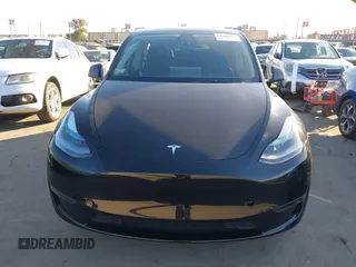 2024 Tesla Model Y Long Range with VIN 7SAYGDEEXRA216186, listed as a IAAI auction lot 41106653 with 25,331 mi miles and . Bid and sale history available at DreamBid. Image 12.