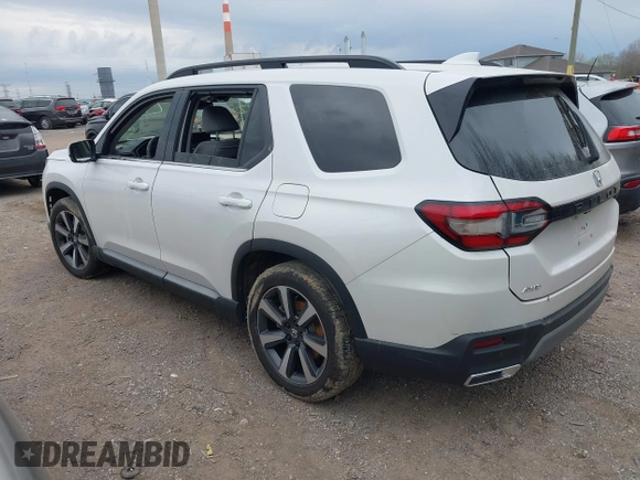 2023 Honda Pilot Elite with VIN 5FNYG1H80PB020937, listed as a IAAI auction lot 42024743 with 20,740 mi miles and . Bid and sale history available at DreamBid. Image 3.