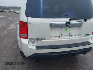 2013 Honda Pilot Touring with VIN 5FNYF4H95DB011661, listed as a IAAI auction lot 42101104 with 298,004 mi miles and . Bid and sale history available at carsss.com. Image 6.