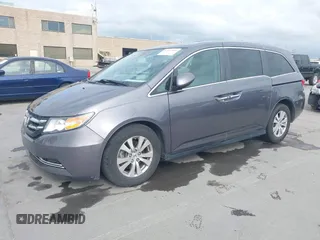 2016 Honda Odyssey EX-L with VIN 5FNRL5H68GB104350, listed as a IAAI auction lot 42023306 with 124,672 mi miles. Bid and sale history available at carsss.com. Image 2.