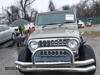 2006 Jeep Wrangler Sport Right Hand Drive with VIN 1J4F449S06P725862, listed as a IAAI auction lot 41562989 with 121,997 mi miles. Bid and sale history available at carsss.com. Image 12.