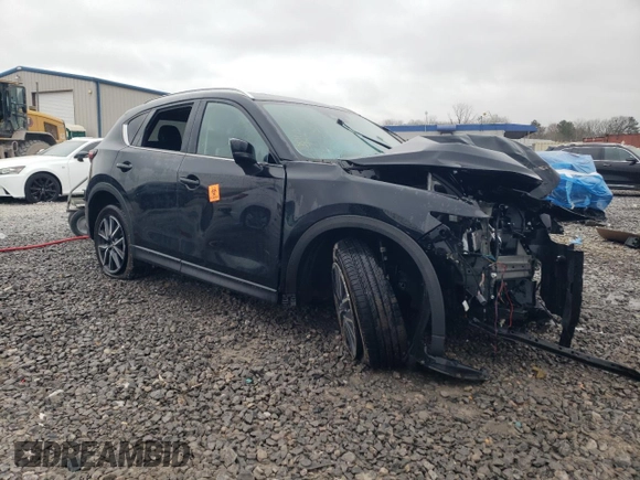 2018 Mazda CX-5 Grand Touring z VIN JM3KFBDM0J0403095, wystawiony jako Copart lot #48594495 z przebiegiem Nie podano mil oraz Szkoda całkowita • Salvage title. Historia ofert i sprzedaży dostępna na DreamBid. Obrazek 4.