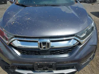 2018 Honda CR-V EX with VIN 2HKRW2H58JH613523, listed as a IAAI auction lot 42104837 with 122,981 mi miles and . Bid and sale history available at DreamBid. Image 6.