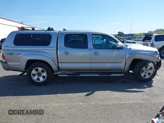 2014 Toyota Tacoma with VIN 3TMLU4EN7EM146705, listed as a IAAI auction lot 41949827 with 147,887 mi miles and . Bid and sale history available at DreamBid. Image 13.
