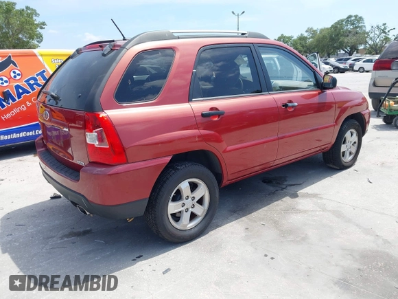 2009 Kia Sportage LX with VIN KNDJE723897599966, listed as a IAAI auction lot 42107627 with 118,512 mi miles. Bid and sale history available at carsss.com. Image 4.