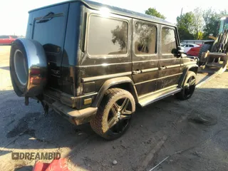 2005 Mercedes-Benz G-Class with VIN WDCYR49E25X156547, listed as a IAAI auction lot 38640157 with 241,209 mi miles. Bid and sale history available at carsss.com. Image 4.