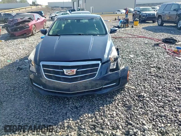 2015 Cadillac ATS Standard AWD z VIN 1G6AG1RX2F0121274, wystawiony jako Copart lot #48011165 z przebiegiem 111 579 mil mil oraz Szkoda całkowita • Salvage title. Historia ofert i sprzedaży dostępna na DreamBid. Obrazek 13.