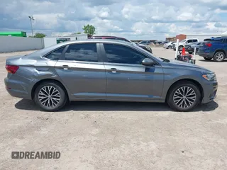 2019 Volkswagen Jetta S z VIN 3VWC57BUXKM061537, wystawiony jako IAAI lot #42170921 z przebiegiem 88 476 mil mil oraz . Historia ofert i sprzedaży dostępna na DreamBid. Obrazek 13.