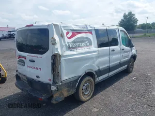 2016 Ford Transit Cargo with VIN 1FTYE1ZM9GKB17364, listed as a IAAI auction lot 42702871 with 142,000 mi miles and . Bid and sale history available at DreamBid. Image 4.