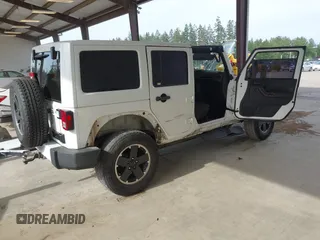 2012 Jeep Wrangler Unlimited Sahara with VIN 1C4BJWEG7CL275883, listed as a IAAI auction lot 42510764 with 149,531 mi miles and . Bid and sale history available at DreamBid. Image 4.