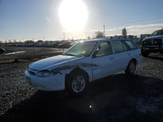 1998 Ford Escort SE with VIN 3FAFP15PXWR242102, listed as a Copart auction lot 77914714 with 164,333 mi miles and Salvage Title. Bid and sale history available at carsss.com. Image 1.