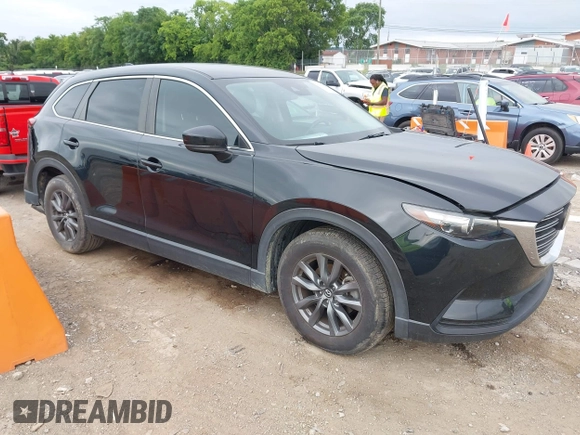 2021 Mazda CX-9 Sport with VIN JM3TCABY6M0522352, listed as a IAAI auction lot 42613136 with 106,167 mi miles and . Bid and sale history available at DreamBid. Image 1.