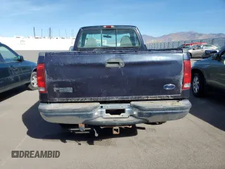 1999 Ford F-250 with VIN 1FTNF21S1XED16309, listed as a Copart auction lot 77267764 with 216,158 mi miles and Clean title. Bid and sale history available at DreamBid. Image 6.