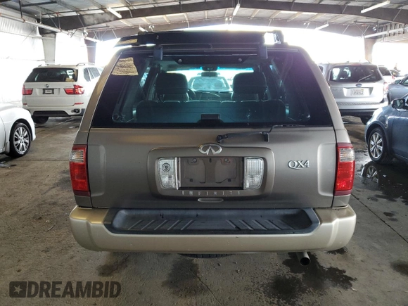 2001 Infiniti QX4 with VIN JNRDR09X21W204448, listed as a Copart auction lot 82619574 with 114,520 mi miles and Salvage Title. Bid and sale history available at DreamBid. Image 6.
