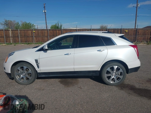 2012 Cadillac SRX Performance Collection z VIN 3GYFNEE30CS652829, wystawiony jako IAAI lot #42156961 z przebiegiem 106 473 mil mil oraz . Historia ofert i sprzedaży dostępna na DreamBid. Obrazek 14.