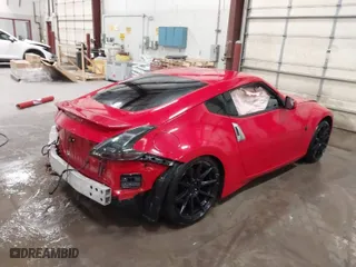 2014 Nissan 370Z with VIN JN1AZ4EHXEM633723, listed as a IAAI auction lot 41588284 with 1 mi miles. Bid and sale history available at carsss.com. Image 4.