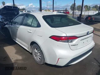 2021 Toyota Corolla Hybrid LE with VIN JTDEAMDE7MJ012694, listed as a IAAI auction lot 41794233 with 103,363 mi miles. Bid and sale history available at carsss.com. Image 3.