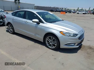 2017 Ford Fusion Hybrid SE with VIN 3FA6P0LU5HR285381, listed as a IAAI auction lot 42597789 with 129,662 mi miles and . Bid and sale history available at DreamBid. Image 1.