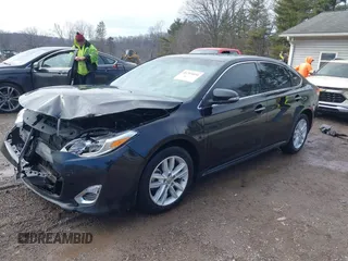 2014 Toyota Avalon Limited with VIN 4T1BK1EB2EU103936, listed as a IAAI auction lot 41703894 with 104,657 mi miles. Bid and sale history available at carsss.com. Image 2.