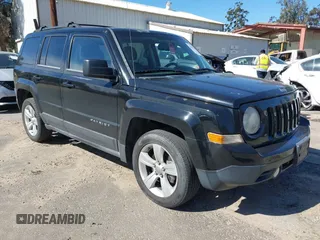 2013 Jeep Patriot Latitude with VIN 1C4NJPFA5DD230031, listed as a IAAI auction lot 41641768 with 153,910 mi miles. Bid and sale history available at carsss.com. Image 1.