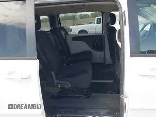 2014 Dodge Grand Caravan American Value with VIN 2C4RDGBG8ER140342, listed as a IAAI auction lot 42198306 with 135,564 mi miles and . Bid and sale history available at DreamBid. Image 8.