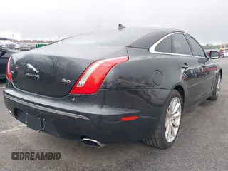 2014 Jaguar XJ with VIN SAJWA1CZ0E8V73966, listed as a IAAI auction lot 41887234 with 120,804 mi miles and . Bid and sale history available at DreamBid. Image 4.