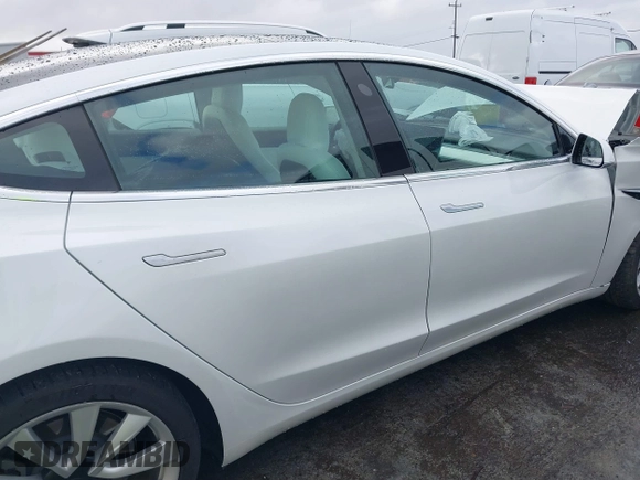 2020 Tesla Model 3 Standard Range Plus with VIN 5YJ3E1EA0LF741311, listed as a IAAI auction lot 41581931 with 43,284 mi miles. Bid and sale history available at carsss.com. Image 13.
