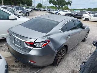 2014 Mazda 6 i Grand Touring с VIN JM1GJ1W6XE1159641, выставлен на аукционе IAAI как лот 39305628 с пробегом 107 853 миль миль и . История ставок и продаж доступна на DreamBid. Изображение 4.