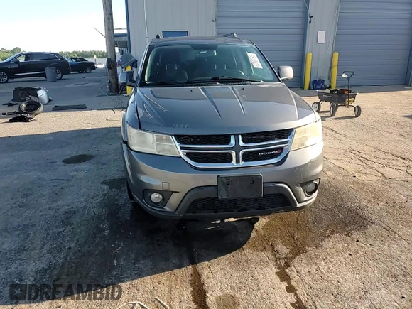 2013 Dodge Journey SXT with VIN 3C4PDCBG0DT522408, listed as a Copart auction lot 62699195 with 130,665 mi miles and Salvage title. Bid and sale history available at DreamBid. Image 14.
