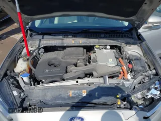 2016 Ford Fusion Titanium Hybrid with VIN 3FA6P0RU5GR171287, listed as a IAAI auction lot 41918195 with 74,721 mi miles. Bid and sale history available at carsss.com. Image 10.