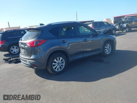 2014 Mazda CX-5 Sport with VIN JM3KE2BE4E0414721, listed as a IAAI auction lot 41408914 with Not Provided miles and . Bid and sale history available at carsss.com. Image 4.