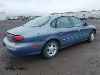 1999 Ford Taurus SE with VIN 1FAFP53U5XG190788, listed as a IAAI auction lot 41880104 with 68,810 mi miles and . Bid and sale history available at DreamBid. Image 4.
