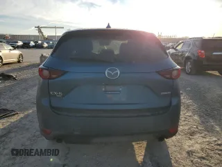 2020 Mazda CX-5 Touring with VIN JM3KFBCM9L0737243, listed as a Copart auction lot 46908495 with 76,956 mi miles and Salvage Title. Bid and sale history available at carsss.com. Image 6.