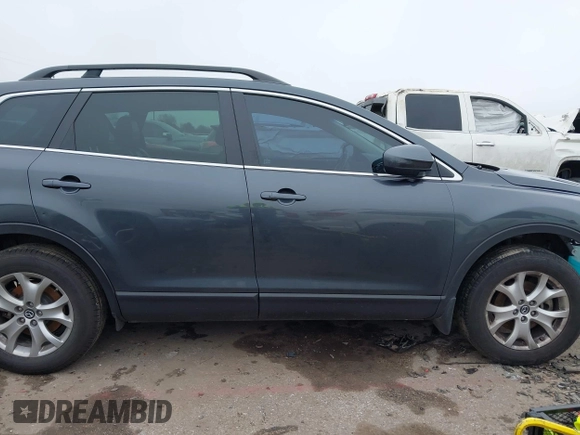 2014 Mazda CX-9 Touring with VIN JM3TB2CA1E0427984, listed as a IAAI auction lot 41620770 with 88,305 mi miles and . Bid and sale history available at DreamBid. Image 14.