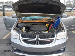 2017 Dodge Grand Caravan SXT with VIN 2C4RDGCG9HR677157, listed as a IAAI auction lot 41470342 with 66,611 mi miles and . Bid and sale history available at DreamBid. Image 10.