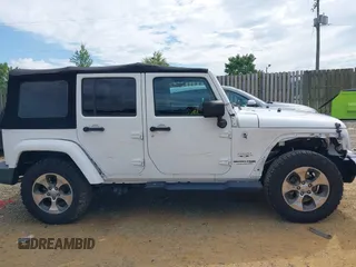 2018 Jeep Wrangler Unlimited Altitude with VIN 1C4HJWEGXJL870606, listed as a IAAI auction lot 42693031 with 92,735 mi miles and . Bid and sale history available at DreamBid. Image 14.