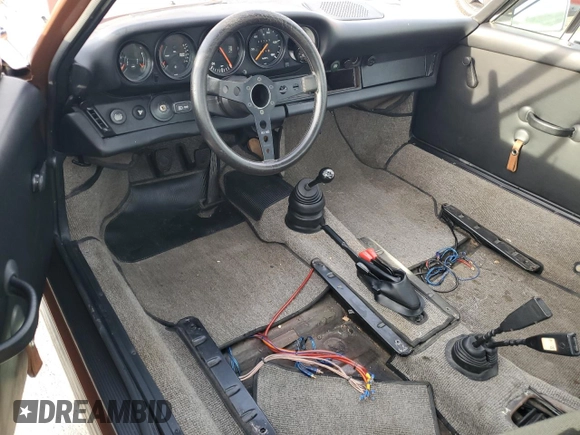 1975 Porsche 911 with VIN 9115201599, listed as a Copart auction lot 79267654 with 69,699 mi miles and Salvage title. Bid and sale history available at DreamBid. Image 8.