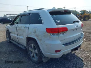 2015 Jeep Grand Cherokee Overland with VIN 1C4RJFCGXFC880096, listed as a IAAI auction lot 42706085 with 74,044 mi miles and . Bid and sale history available at DreamBid. Image 3.