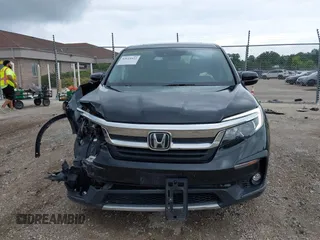 2020 Honda Pilot EX-L with VIN 5FNYF6H57LB059332, listed as a IAAI auction lot 42614422 with 110,279 mi miles and . Bid and sale history available at DreamBid. Image 12.